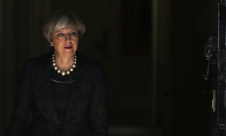 Theresa May leaves Downing Street.
