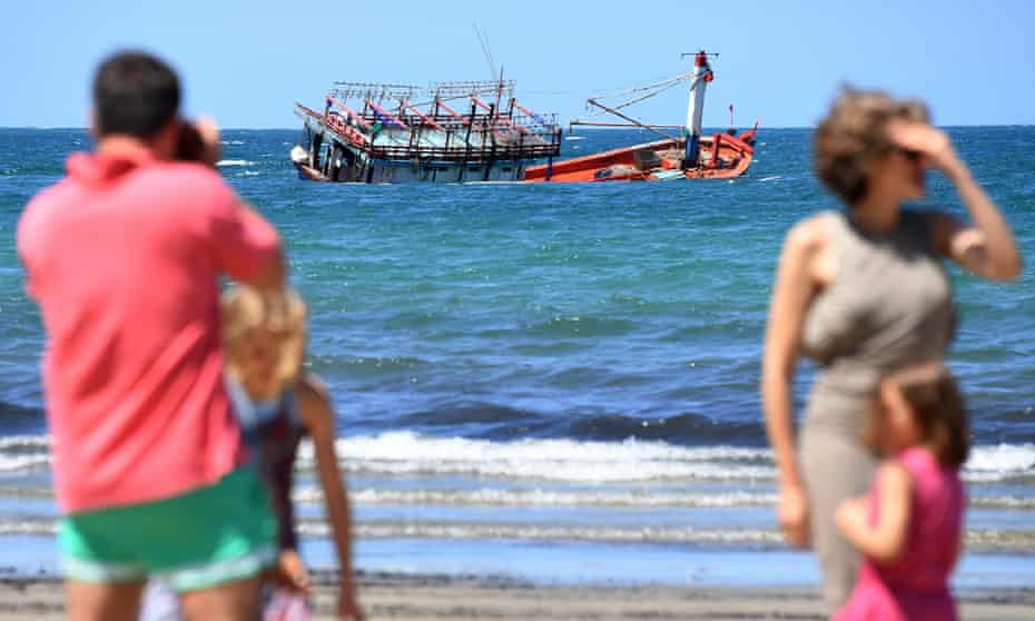 The sunken fishing vessel, believed to be carrying Vietnamese asylum seekers, off the beach at Cape Kimberley at the mouth of the Daintree River in Queensland.