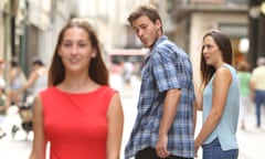 Disloyal man walking with his girlfriend and looking amazed at another seductive girl<br>F1M150 Disloyal man walking with his girlfriend and looking amazed at another seductive girl