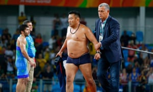 A Mongolian official strips off
