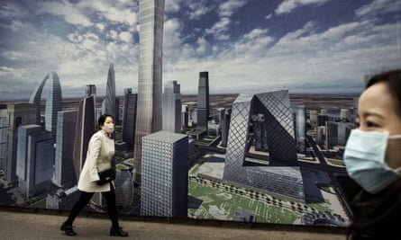 A Chinese woman wears a mask as she walks passed a billoard showing the city on a clear day A Chinese woman wears a mask as she walks passed a billboard showing the city on a clear day