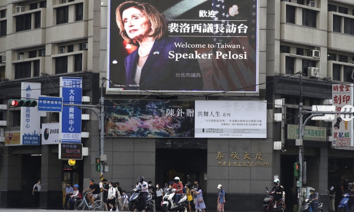 People walk past a billboard welcoming U.S. House Speaker Nancy Pelosi, in Taipei, Taiwan, Aug 3, 2022.