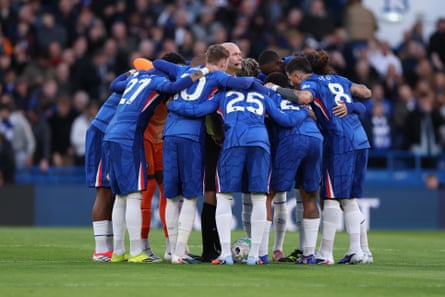 Chelsea’s pre-match huddle with the referee, Paul Tierney, in the middle of it