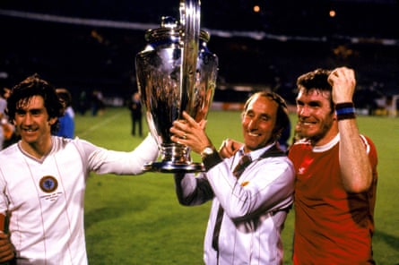 Aston Villa manager Tony Barton holds the European Cup, with captain Dennis Mortimer (left) and goalscorer Peter Withe in May 1982.