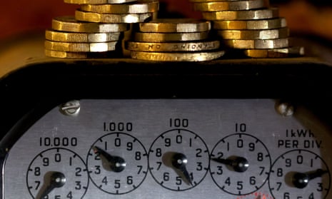 pound coins sit above an old-style gas meter