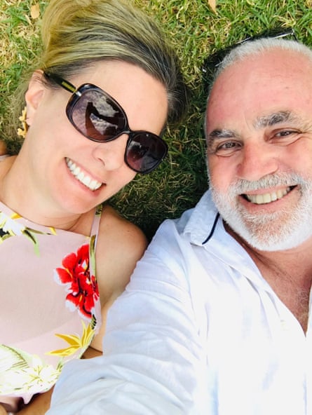 Marisha Matthews and Paul lying on the grass, taking a selfie at Womadelaide festival.