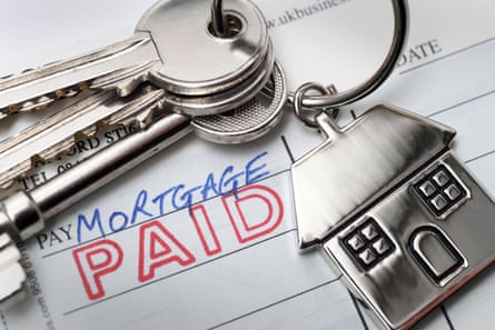 Stamp saying “mortgage paid” with house keys