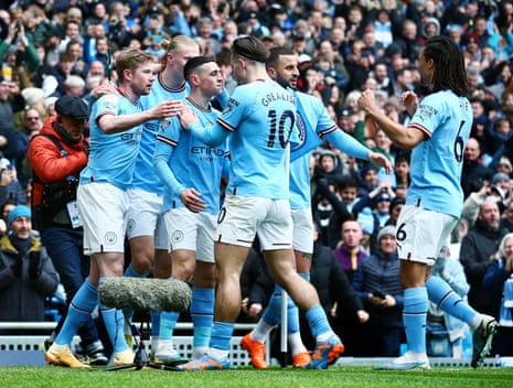 Manchester City’s players congratulate Phil Foden for scoring their opener against Newcastle United, his 13th goal in all competitions this season.