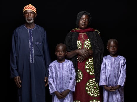 Massène Mbaye (on left) and Penda Dieye, with their twins Assane and Ousseynou. They moved in with relatives after the sea took their home on the beach of Guet N’Dar
