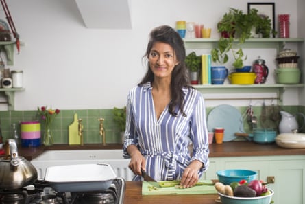 Rukmini Iyer chops vegetables in a kitchen
