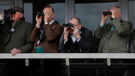 Racegoers with binoculars.