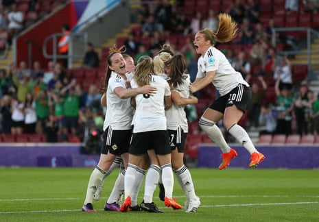 Northern Ireland’s Julie Nelson (hidden) is mobbed by team-mates after pulling a goal back, which is their first goal in a major tournament.