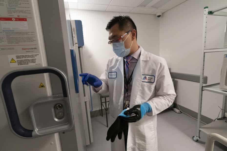 Pharmacist Billy Sin by a refrigerator that will store Covid-19 vaccines at Mount Sinai Queens hospital in New York. Pfizer’s vaccine presents challenges because it must be stored at -94F (-70C).