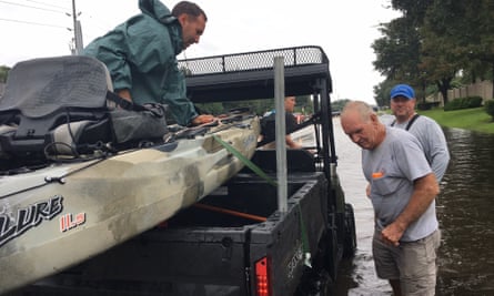 Brad and Wayne Johns load up after a failed attempt to evacuate Houston residents.
