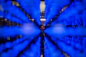 A man stands behind a display designed to help people visualized the concept of Nano Cell technology at CES 2018.