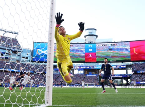 Angus Gunn of Scotland leaps in an attempt to make a save