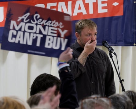 Graham Platner reacts at a campaign town hall meeting in Portland, Maine, in June.
