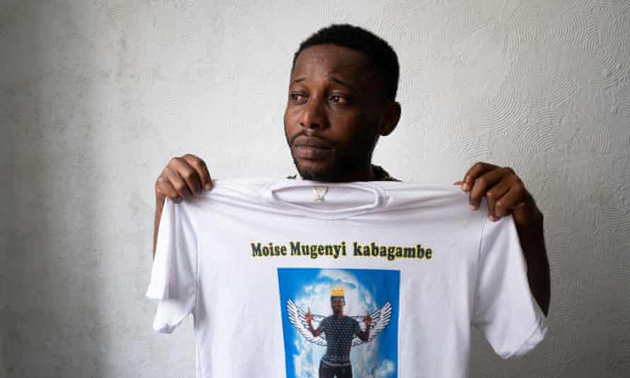 Chadrac Kembilu, a cousin of Moïse Kabagambe, shows a T-shirt with a Kabagambe image at a Congolese community center in the Costa Barros neighbourhood in Rio de Janeiro.