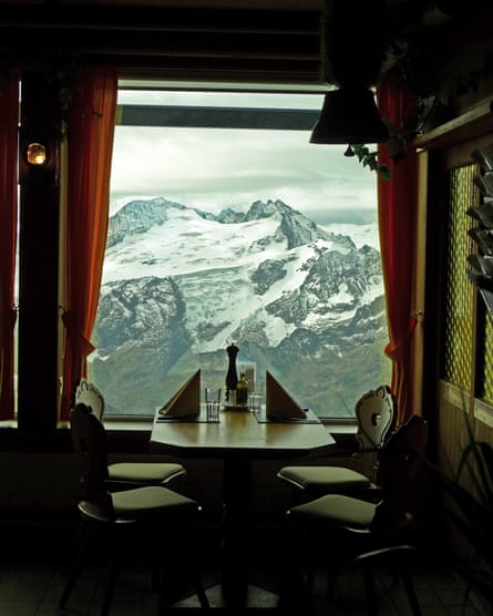 View of snowy peaks out the window of a restaurant near Titlis mountain, Switzerland.