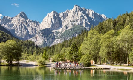 Group of mountainbikers at Jasna Lake, Slovenia.