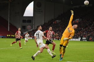 Fylde’s midfielder Jordan Williams chips the ball over Sheffield United’s goalkeeper Dean Henderson to score, though his team eventually lost 2-1.