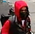 Man in black face mask and red jumpsuit.