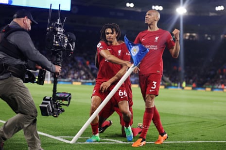 Liverpool's Trent Alexander-Arnold (centre) celebrates with Fabinho (right) after scoring his side's third goal during the Premier League match between Leicester City and Liverpool.