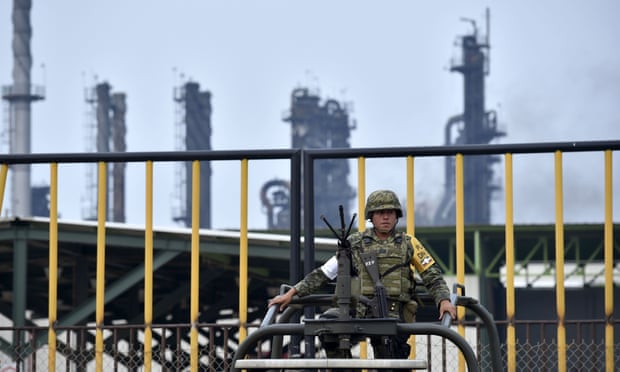 A soldier stands guard at the Pemex Pajaritos plant in Coatzacoalcos, Veracruz state, Mexico.