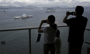 Residents taking photos of the Liaoning
