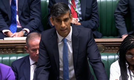 Rishi Sunak standing in front of the Tory benches in parliament