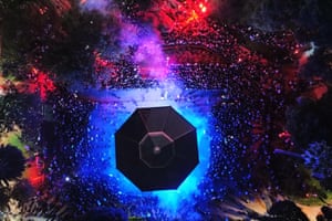 Drone shot of crowds around a illuminated building