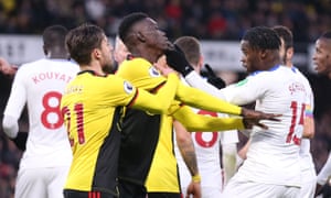 Ismaïla Sarr and Jeffrey Schlupp clash during a bad-tempered game.