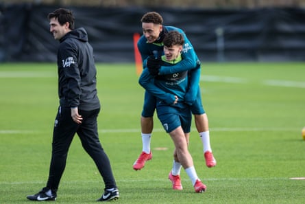 Andoni Iraola walks past Milos Kérkez arsenic he gives Marcus Tavernier a piggyback during a training convention astatine Bournemouth