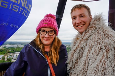 Joe Lycett and Sarah Millican float over Vilnius in a hot-air balloon.