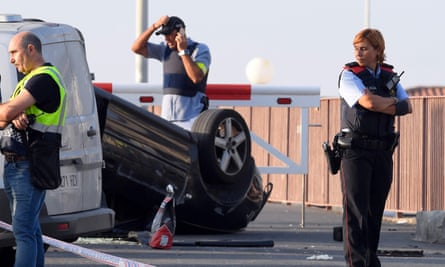 The presumed terrorists’ car, lying overturned on the seafront road in Cambrils.