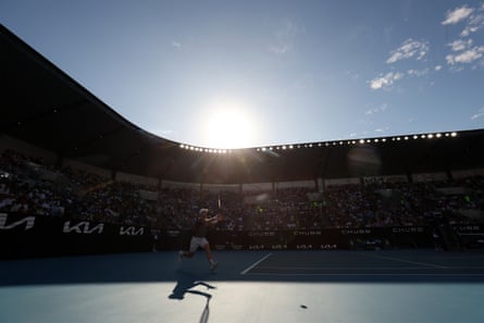 Andy Murray hits a return to Argentina’s Tomás Martín Etcheverry under sunny skies in Melbourne.
