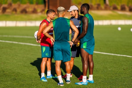 The Wolves manager, César Peixoto (second right), speaks with Kieran Trippier (left), Andre (centre), and Toti Gomes at a pre-season training in Faro, Portugal in July.