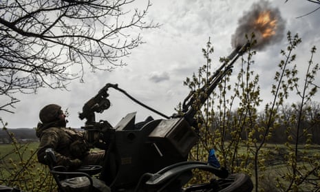 A Ukrainian soldier fires self-propelled howitzers near the outskirts of Bakhmut on Friday