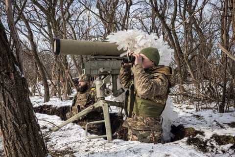 Ukrainian soldiers look for a target as they prepare to fire a Kornet anti-tank weapon at a front line position in southern Donbas, Ukraine.