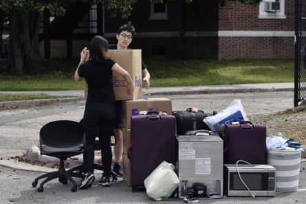 Duke freshmen Feng Cong from Singapore and Cassie Lu from Thailand move out of their dorm at Duke University on 15 March.