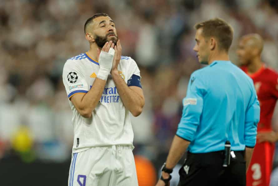 Karim Benzema waits to hear that his first-half strike has been ruled offside by VAR.