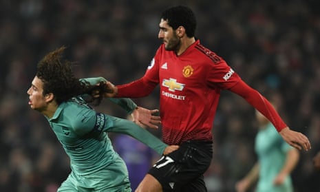 Arsenal’s Mattéo Guendouzi has his hair pulled by Marouane Fellaini at Manchester United.