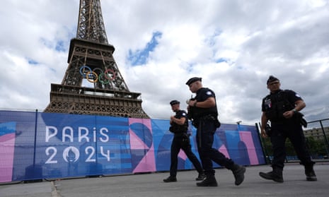 Paris transformed into city of metal and QR codes as security ramps up for Olympics | Paris Olympic Games 2024 | The Guardian