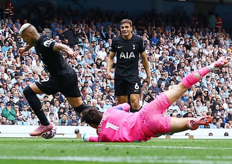 Richarlison of Tottenham Hotspur takes the ball from Manchester City goalkeeper James Trafford on the build up to the second goal.