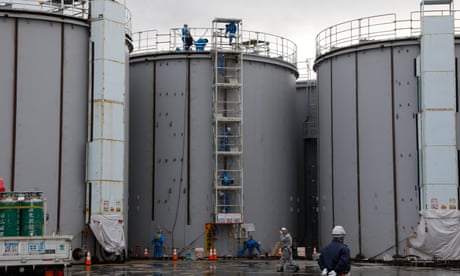 Workers construct water storage tanks at the Fukushima Daiichi nuclear power plant in 2020