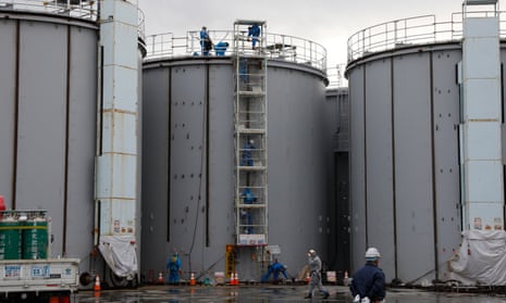 Workers construct water storage tanks at the Fukushima Daiichi nuclear power plant in 2020. 
