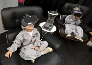 Young boys wear VR devices in Seoul, South Korea