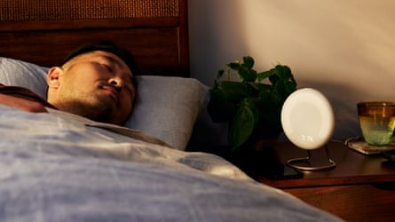 man sleeps next to circular device