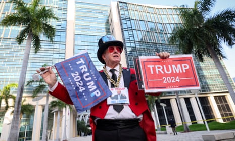 A supporter of Donald Trump outside the Miami court where Trump will appear.
