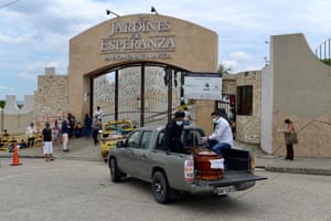 Coffins are transported to a cemetery in Guayaquil